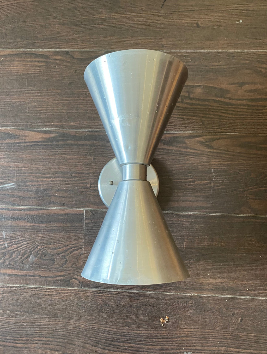 Known as the "hourglass", "bow tie" and "double cone", this authentic vintage wall sconce creates the perfect finish for your Mid-century inspired space- Cook Street Vintage