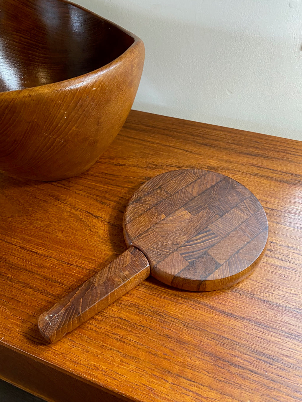 A wonderful small cheese board with spreader designed by Jens Harald Quistgaard for Dansk. Dansk Endwood Staved Teak Cutting Board with Spreader- Cook Street Vintage