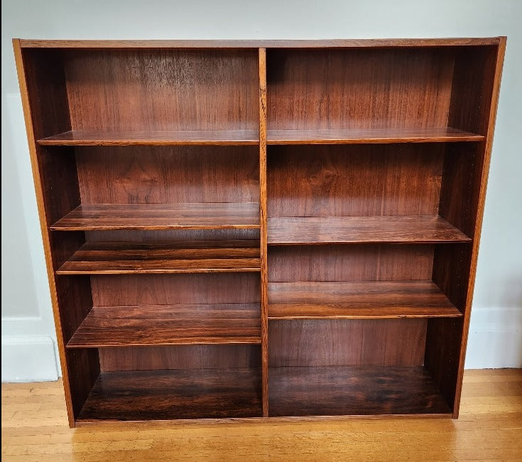 Beautiful rosewood book shelves with 7 adjustable shelves.  Works well on its own or on top our matching credenza. Made in Denmark by Poul Dogvad for Hundevad & Co.- Cook Street Vintage