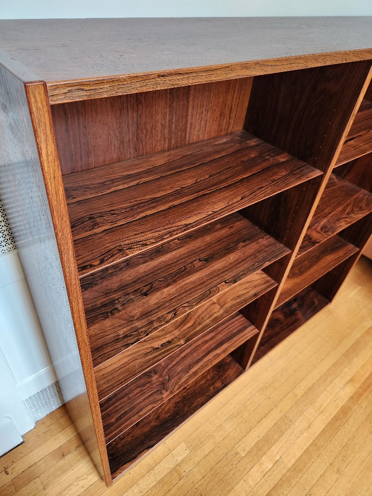 Beautiful rosewood book shelves with 7 adjustable shelves.  Works well on its own or on top our matching credenza. Made in Denmark by Poul Dogvad for Hundevad & Co.- Cook Street Vintage