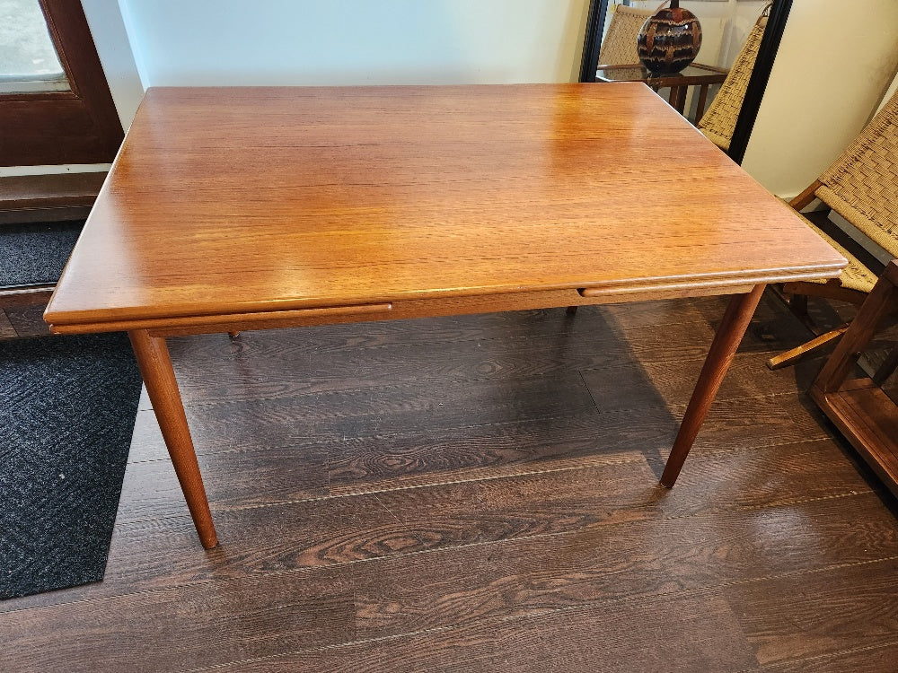 Mid-century Scandinavian Teak Dining Table. Made in Denmark by GP Farum