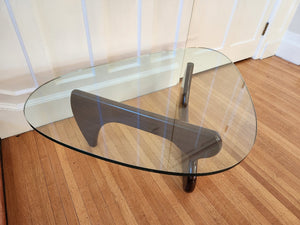 High quality Noguchi replica table. Originally designed in 1933, this beautiful walnut rendition has a gorgeous thick flat edge glass top- Cook Street Vintage