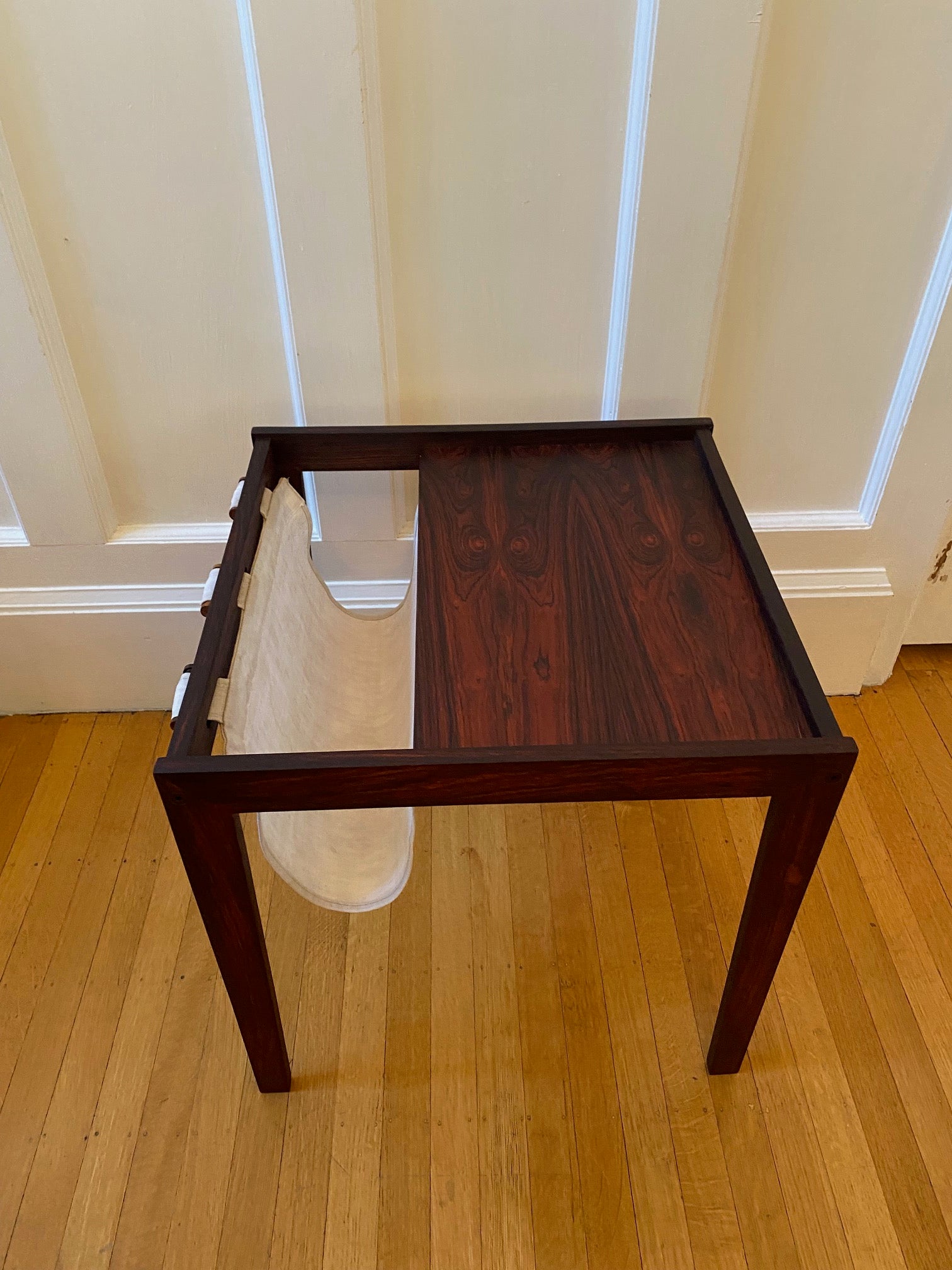 Stunning Danish modern rosewood side table with canvas magazine and book sling.- Cook Street Vintage 