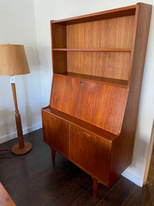 Gorgeous teak secretary with drop-down desk. Multiple storage drawers with dovetail joinery and adjustable shelves. Made in Denmark- Cook Street Vintage