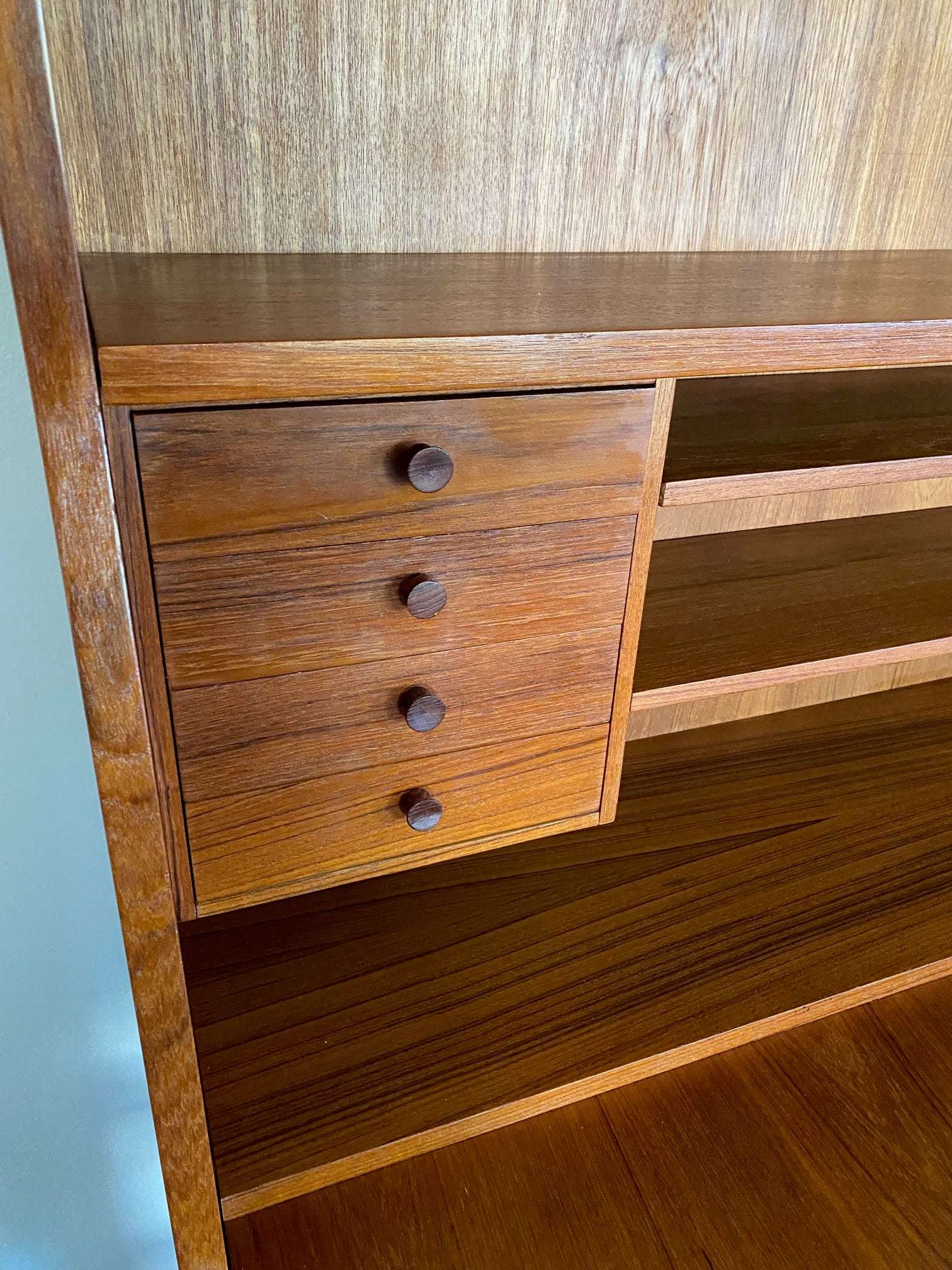 Gorgeous teak secretary with drop-down desk. Multiple storage drawers with dovetail joinery and adjustable shelves. Made in Denmark- Cook Street Vintage