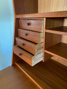 Gorgeous teak secretary with drop-down desk. Multiple storage drawers with dovetail joinery and adjustable shelves. Made in Denmark- Cook Street Vintage