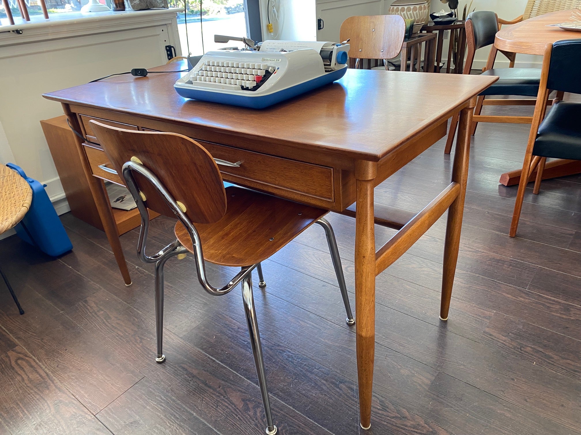 Elegant vintage walnut desk. Pretty tapered legs and beautiful lines.Nice large work surface and three handy drawers- Cook Street Vintage