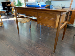 Side and back view of Elegant vintage walnut desk. Pretty tapered legs and beautiful lines.Nice large work surface and three handy drawers- Cook Street Vintage