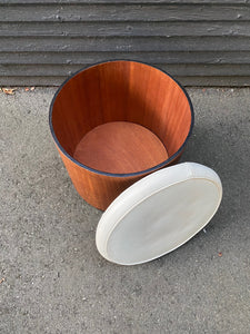 Top off showing interior storage of beautiful round stool with removable cream vinyl top. Interior is in near-perfect condition. Teak with contrasting black painted base. Works well as an ottoman or a side table. Store your wool- or socks! Made in Canada by Walter Depping Furniture- Cook Street Vintage