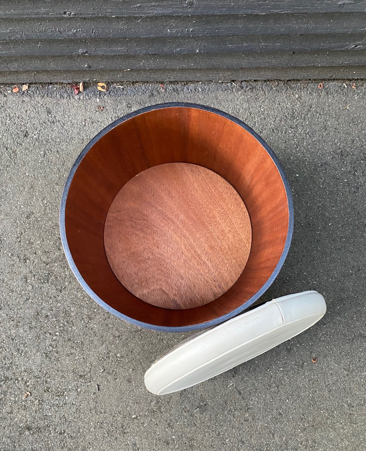 Interior of round stool with removable cream vinyl top. Interior is in near-perfect condition. Teak with contrasting black painted base. Works well as an ottoman or a side table. Store your wool- or socks! Made in Canada by Walter Depping Furniture- Cook Street Vintage