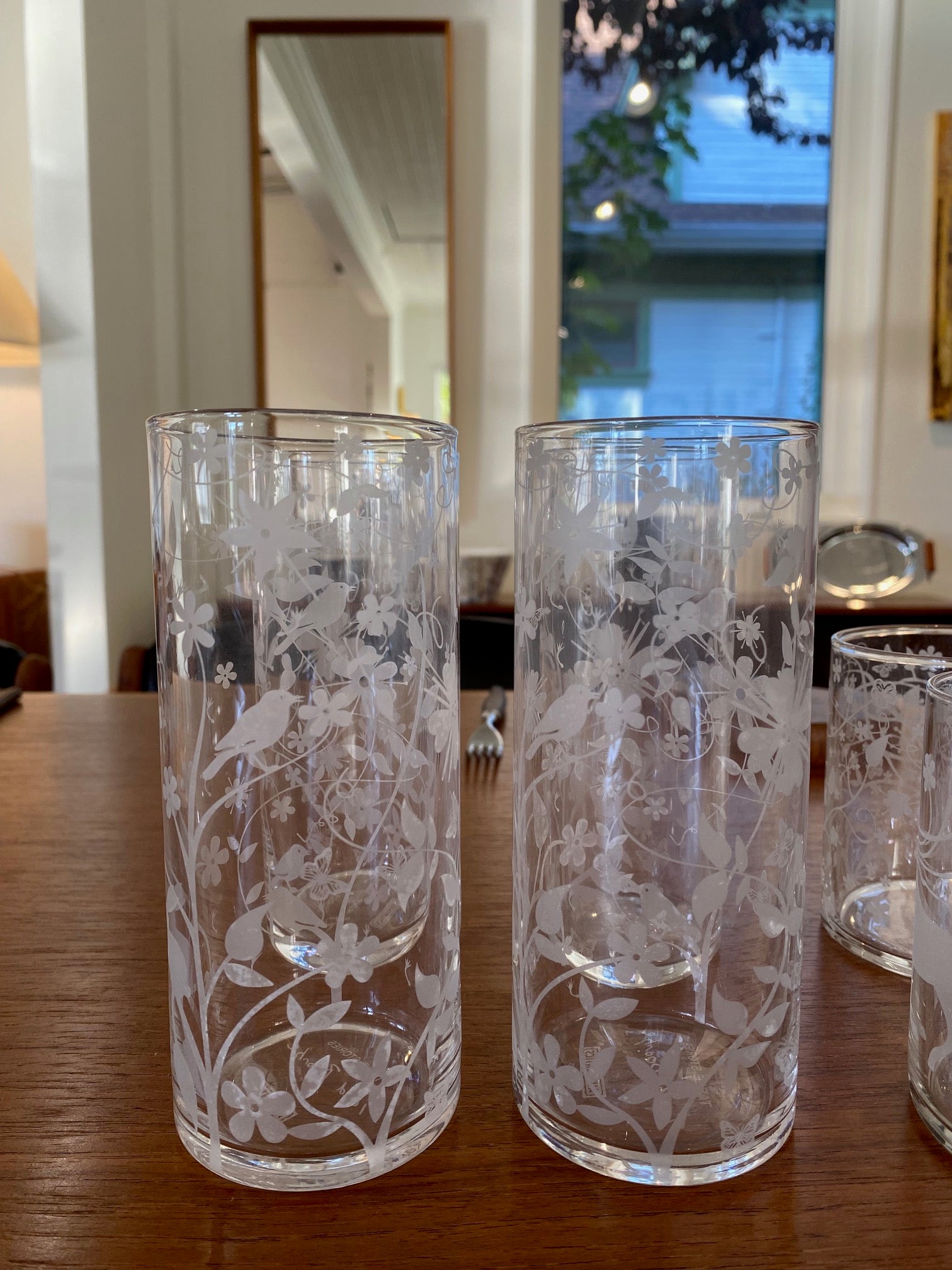 Tord Boontje "Table Stories" highball glass tumbler. Beautiful intricate etched detail of birds and flora. Shown with the Tord Boontje lowball-Cook Street Vintage