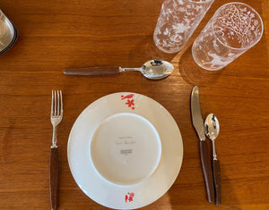 Reverse side showing logo of Tord Boontje "Table Stories" 2005  plate. Shown with our Tord Boontje highball and Tord Boontje lowball glasses, and our Glosswood cutlery-Cook Street Vintage