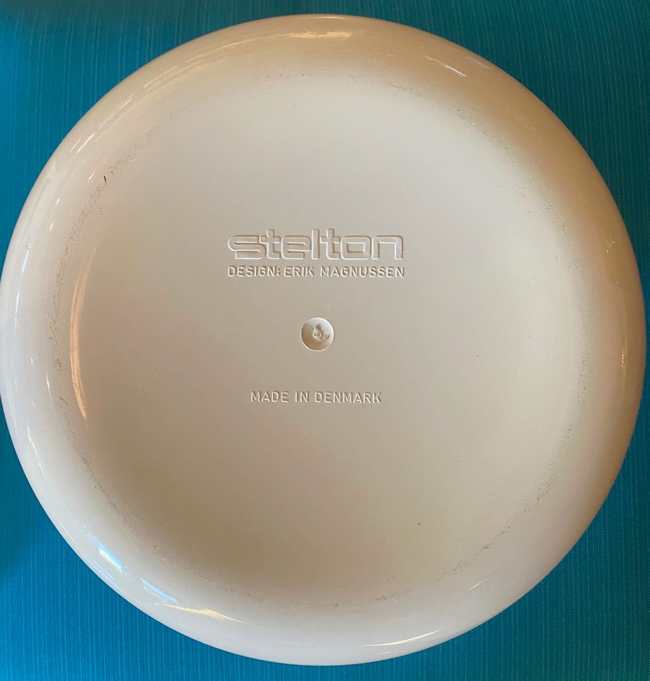 bottom of Fabulous 1970s Mid-century modern ice bucket with sleek design and hidden handle in white plastic. Designed by Erik Magnussen for Stelton.  In amazing vintage condition. Made in Denmark-Cook Steet Vintage