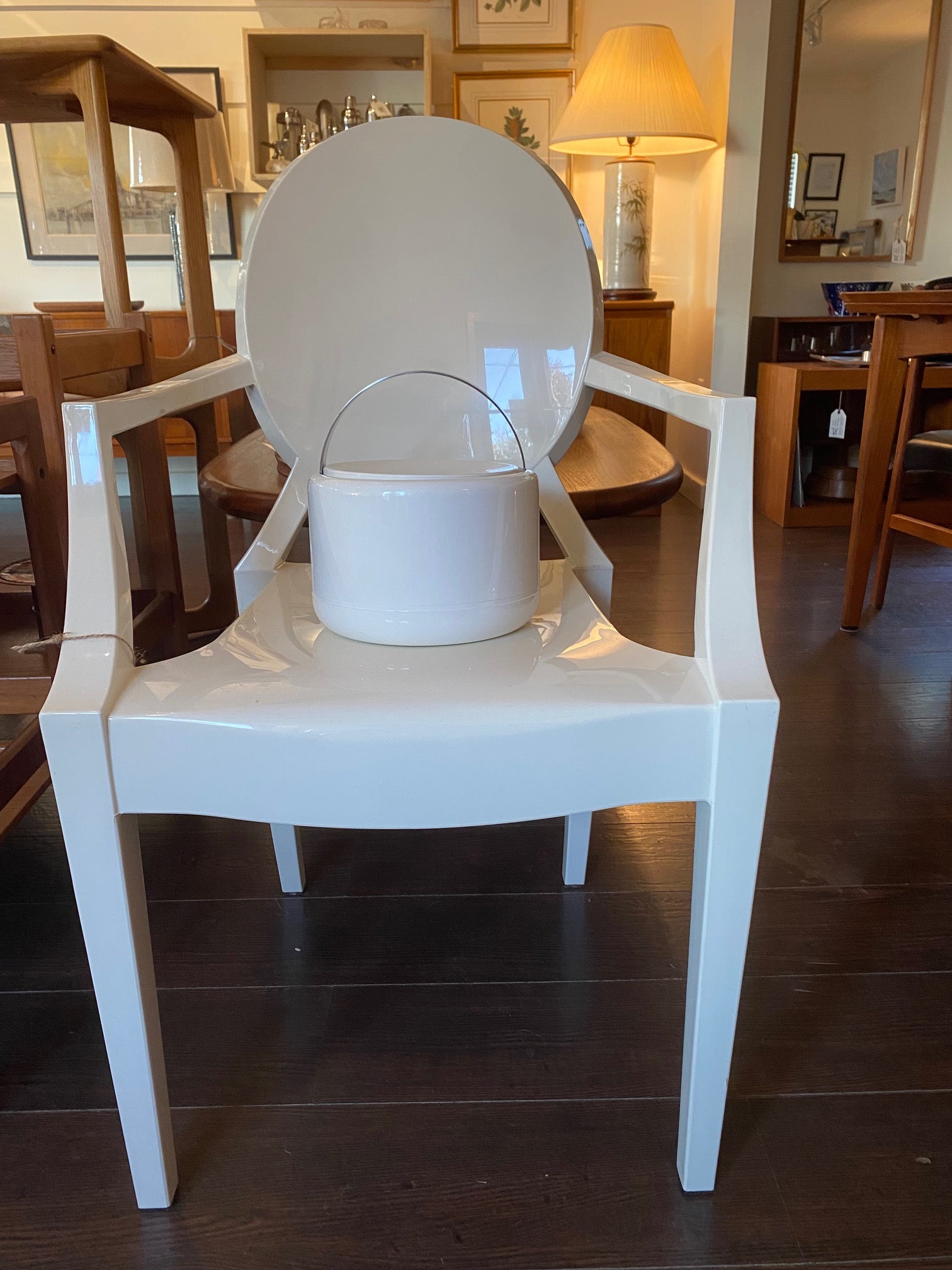 Fabulous 1970s Mid-century modern ice bucket with sleek design and hidden handle in white plastic. Designed by Erik Magnussen for Stelton.  In amazing vintage condition on replica white ghost chair. Made in Denmark-Cook Steet Vintage