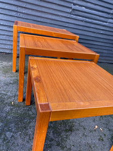 Top view of mid-century teak nesting tables with square legs. made in Denmark stamped on bottom- Cook Steet Vintage
