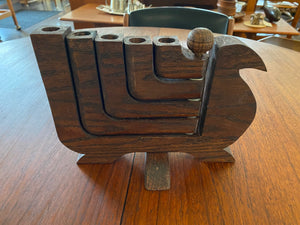 Mid-century wood 5 arm candelabra attributed to Don Shoemaker. This lovely 1970s candleholder has a burn mark on the second arm. Each arm can be splayed to either side of the dove- Cook Street Vintage