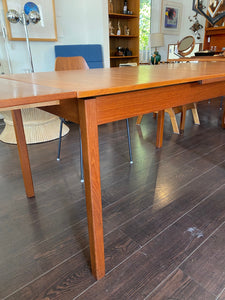 Detail of leg of midcenntury teak dining table with extending leaves- Cook Street Vintage
