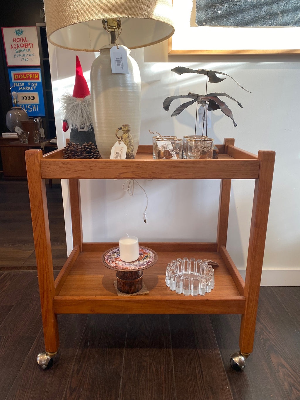 Beautiful mid-century teak cocktail bar cart on casters. A nice side table or trolley that can easily transport your glassware or dishes- Cook Street Vintage