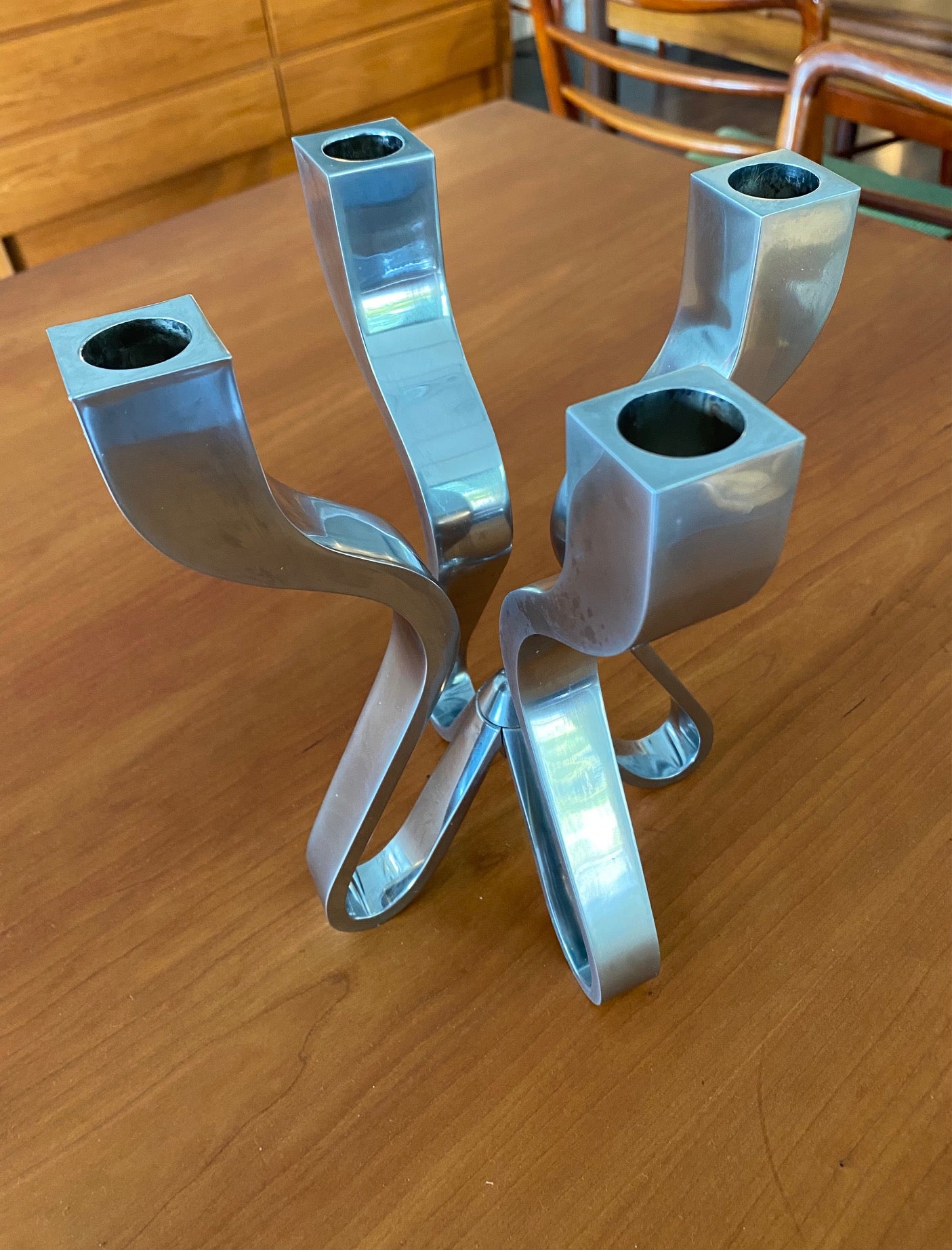 Die-cast four arm metal candle holder with matt chrome finish. Designed by Karim Rashid for Umbra- Cook Street Vintage