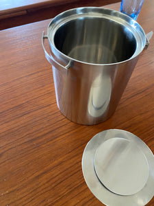 Cylinda line Stetton stainless steel champagne bucket with lid on table. Designed by Arne Jacobsen. Made in Denmark-Cook Street Vintage