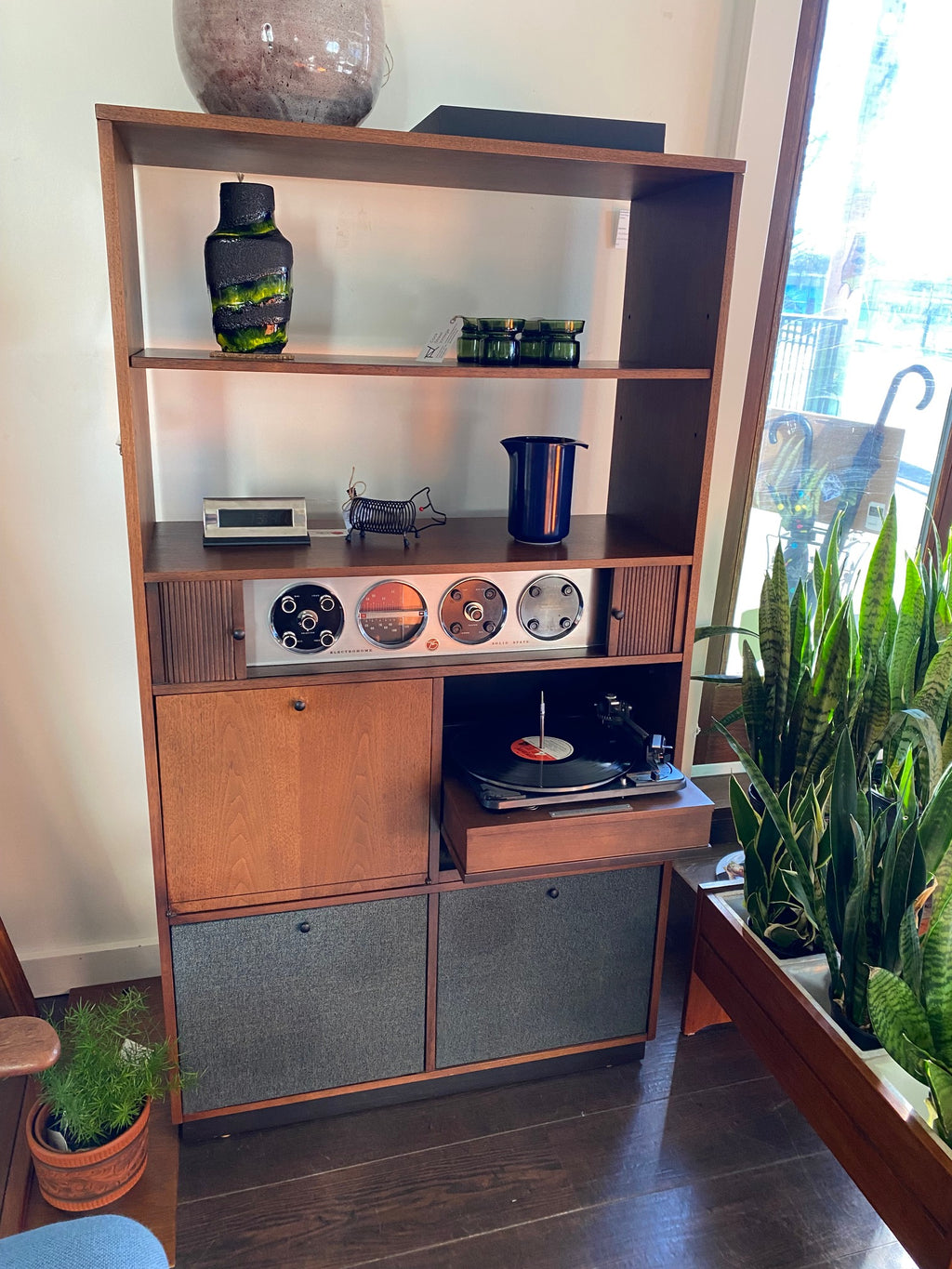 Very cool Electrohome Stereo Cabinet with turntable, AM/FM radio and vinyl storage. Tambour doors slide to discreetly hide controls and dials. Cabinet made by Deilcraft- Cook Street Vintage