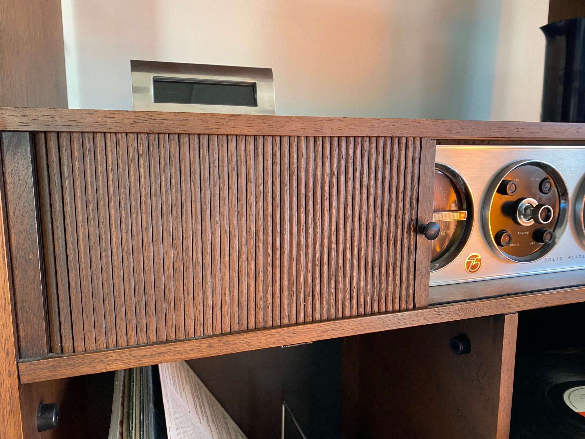 Detail of tambour doors on Very cool Electrohome Stereo Cabinet with turntable, AM/FM radio and vinyl storage. Tambour doors slide to discreetly hide controls and dials. Cabinet made by Deilcraft- Cook Street Vintage