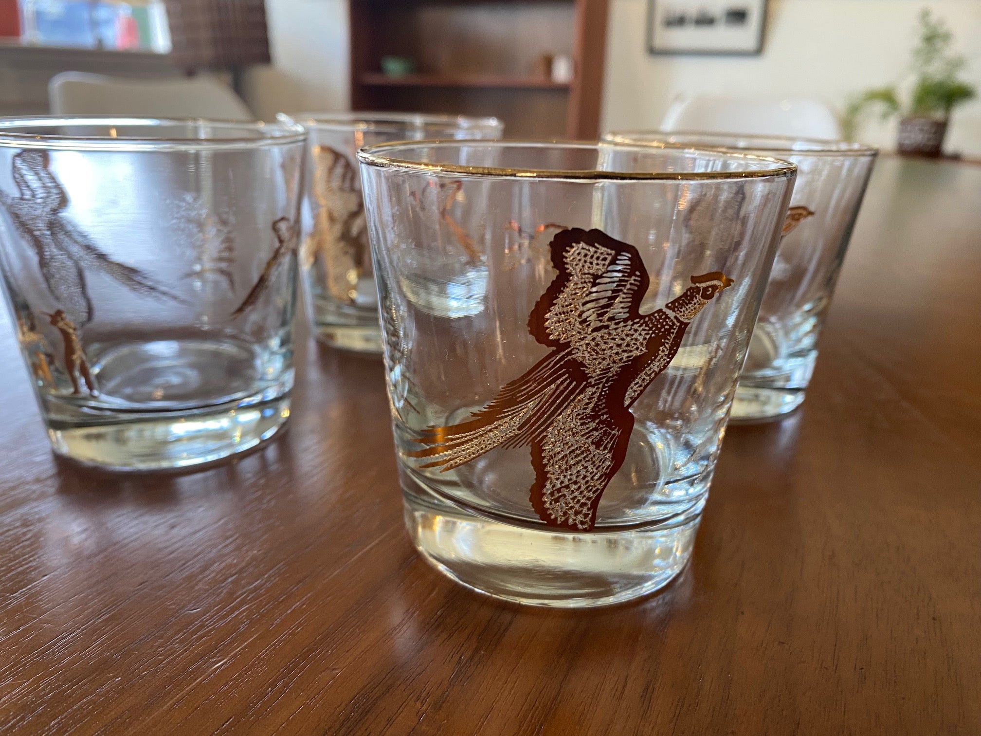Detail of Set of four like-new low ball drinking glasses with pheasants and hunters. Images and gold on rim in excellent condition. Made in the USA by Dominion- Cook Street Vintage