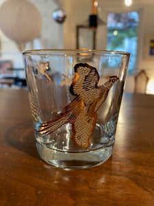 Set of four like-new low ball drinking glasses with pheasants and hunters. Images and gold on rim in excellent condition. Made in the USA by Dominion- Cook Street Vintage