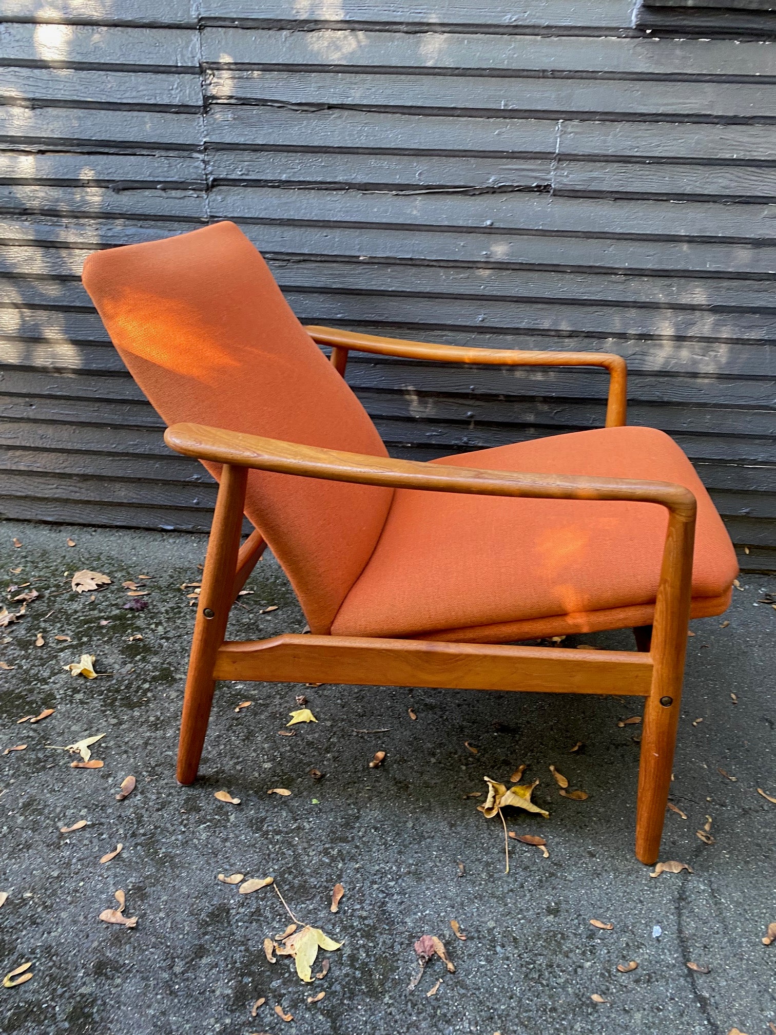 Side view of Fantastic lounge chair in original orange upholstery by SL Mobler. Attributed to Soren Ladefoged.- Cook Street Vintage
