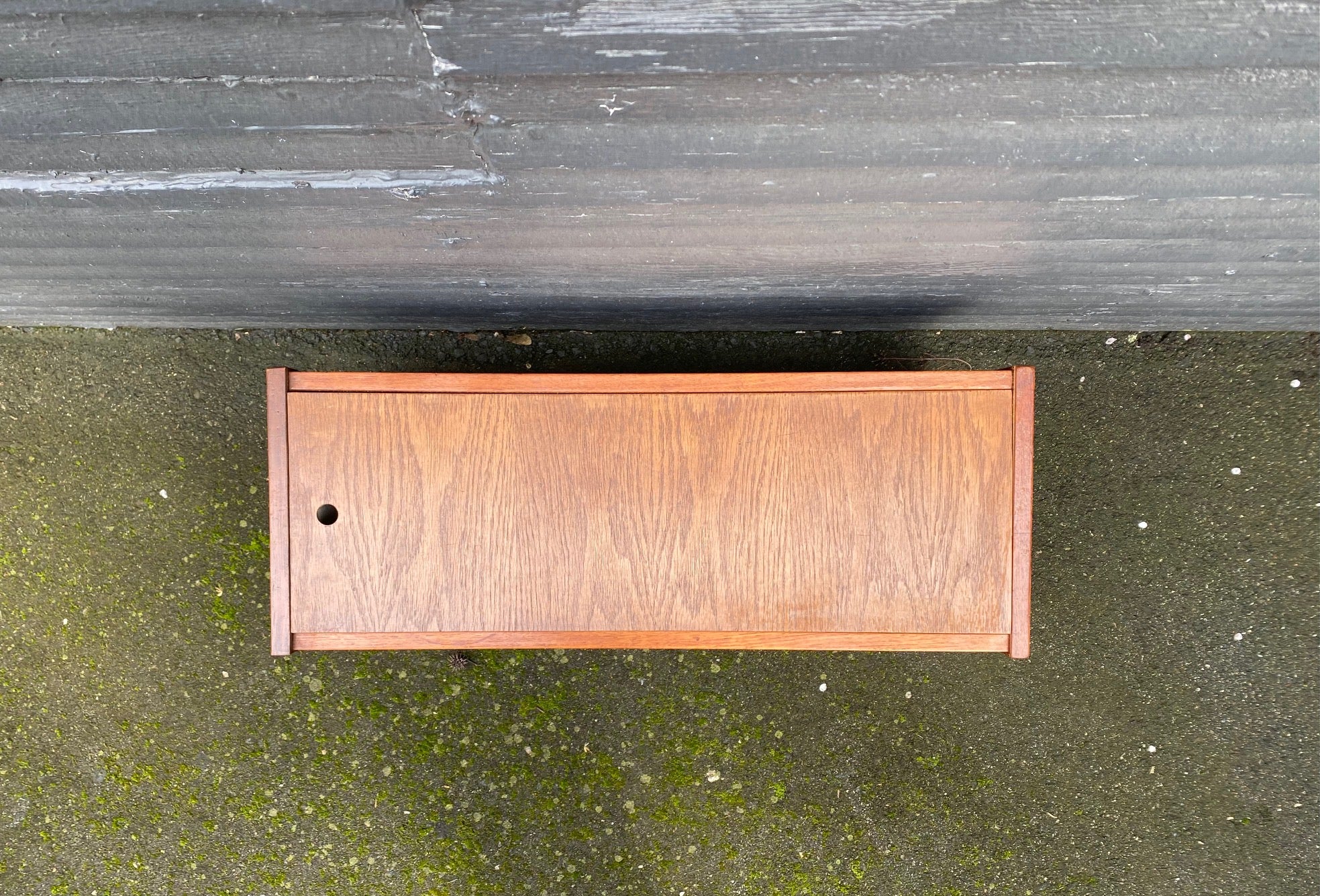 top view with lid. The perfect touch for any room. The original styrofoam inserts accommodate three medium-sized plants. Makeshift wood lid that can transform this unit into a small side table or storage bin- Cook Street Vintage