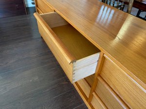 Scandinavian Modern design modern teak bedroom dresser by Feldballes Møbelfabrik. Nine hardwood drawers with sift curved pulls. Made in Denmark- Cook Street Vintage.