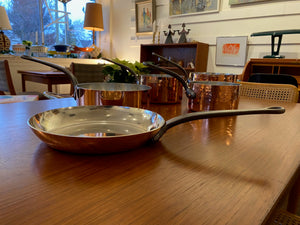 Gorgeous copper fry pan with cast iron handle. Durable 2mm-gauge copper (200 cl thickness) provides superior heat conductivity and temperature control. Professional-quality 18/10 stainless-steel interiors are durable, nonreactive and easy to clean. Cast-iron handles are angled for comfort. Made in France&nbsp; by Mauviel- Cook Street Vintage