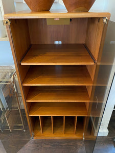 Open smoke lgass doors revealing shelves and ample storage to our vintage teak stereo cabinet- Cook Street Vintage