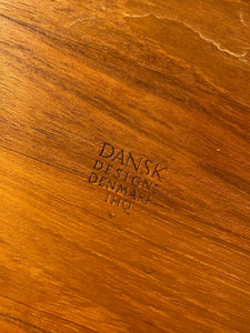 Back stamp of Extra large round 1960s Dansk teak tray with serving handles. Designed by Jens Harald Quistgaard for Dansk. Made in Denmark- Cook Street Vintage