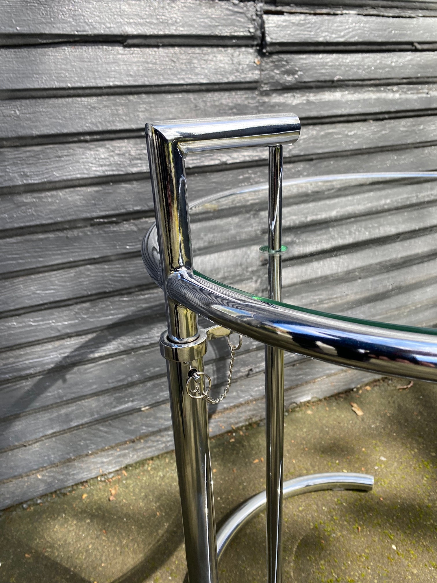 Detail of Nice chrome and glass side table that is height adjustable. A great replica of the E1027 originally designed by Eileen Grey- Cook Street Vintage