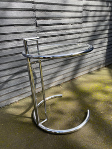 Side view of Nice chrome and glass side table that is height adjustable. A great replica of the E1027 originally designed by Eileen Grey- Cook Street Vintage