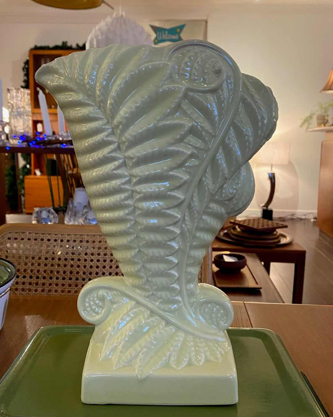 Stunning MCM Beswick vase in the “Fernbank” model #1191, designed by James Howard in 1950. This classic cornucopia-shaped piece, inspired by unfurling fern fronds is a plae green with a beautiful powder blue interior glaze. No chips or crazinng- Cook Street Vintage.