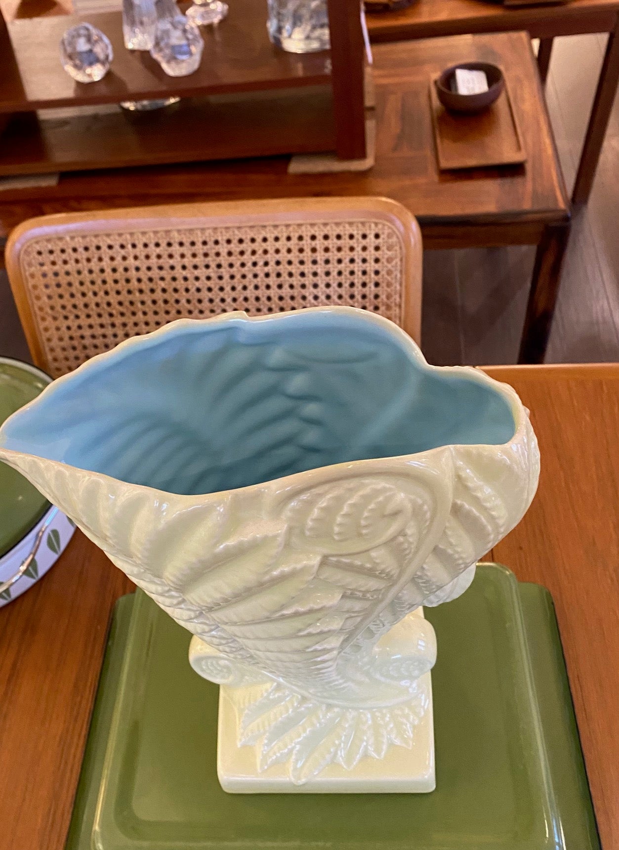 Stunning MCM Beswick vase in the “Fernbank” model #1191, designed by James Howard in 1950. This classic cornucopia-shaped piece, inspired by unfurling fern fronds is a plae green with a beautiful powder blue interior glaze. No chips or crazinng- Cook Street Vintage.