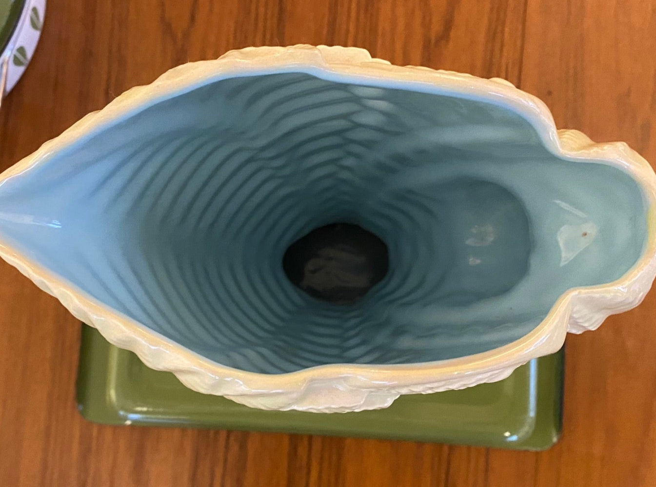 Stunning MCM Beswick vase in the “Fernbank” model #1191, designed by James Howard in 1950. This classic cornucopia-shaped piece, inspired by unfurling fern fronds is a plae green with a beautiful powder blue interior glaze. No chips or crazinng- Cook Street Vintage.