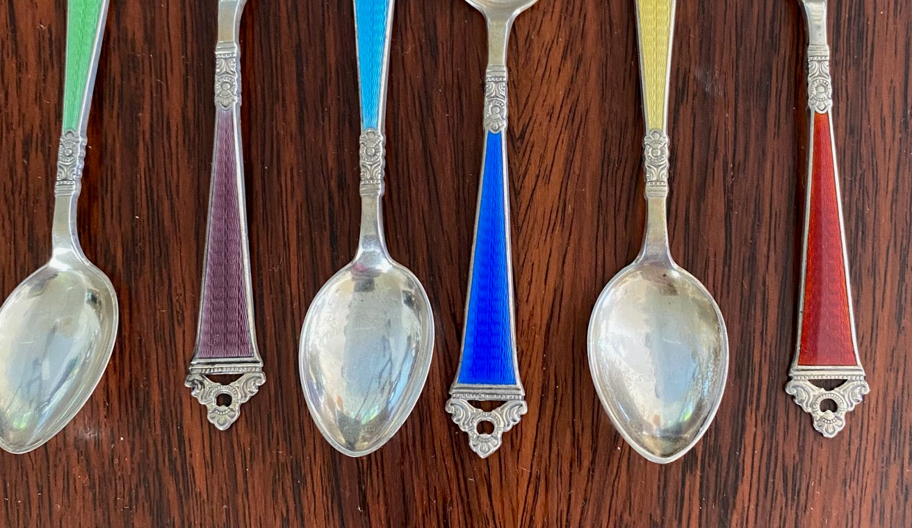 A lovely set of 6 Guilloche Sterling Silver and Enamel Demitasse spoons attributed to Niles Hansen. Pretty accompaniments for a charcuterie board, for condiments are as coffee spoons.     One each of green, plum, aquamarine blue, royal blue, yellow and scarlet red-Cook Street Vintage