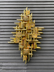 A striking mid-century torched metal art display in brass, with original label. Can be hung vertically or horizontally. Made in Canada.- Cook Street Vintage