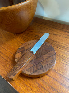A wonderful small cheese board with spreader designed by Jens Harald Quistgaard for Dansk. Dansk Endwood Staved Teak Cutting Board with Spreader- Cook Street Vintage