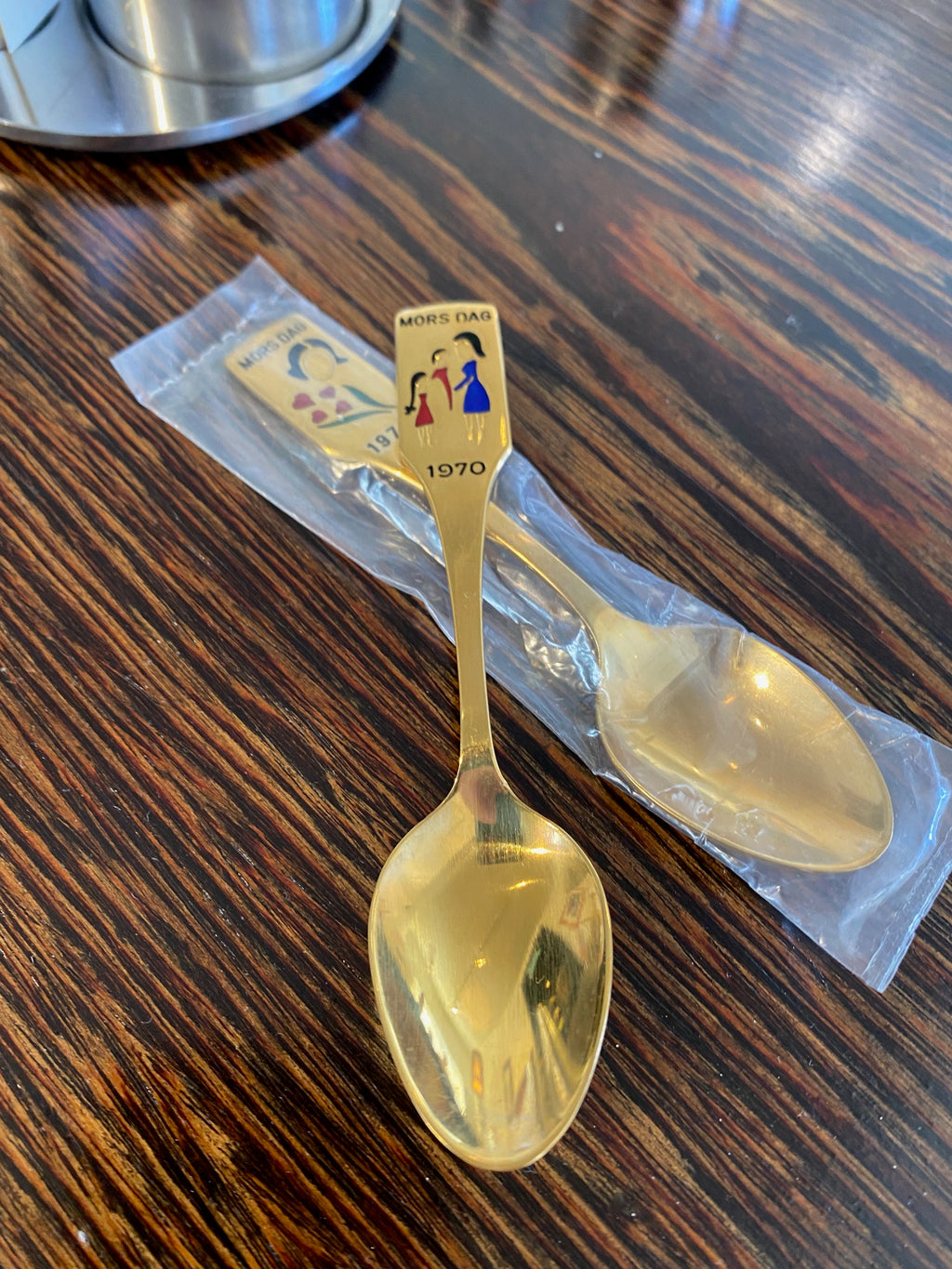 Gold Plated Brass MEKA Souvenier Mars Day Spoon 1970 on top of our 1971 spoon in original package- Cook Street Vintage