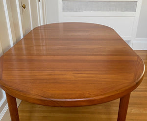 Grain wiht two leaves in. Gorgeous Mid-century honey teak round dining table. Smaller profile than our other round dining tables, this beauty has an elegant staved edge of solid teak- Cook Street Vintage