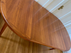 Top view of grain in Gorgeous Mid-century honey teak round dining table. Smaller profile than our other round dining tables, this beauty has an elegant staved edge of solid teak- Cook Street Vintage
