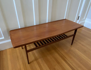 MCM teak coffee tabel with sculped raised edge and slatted second tier magazine shelf- Cook Street Vintage