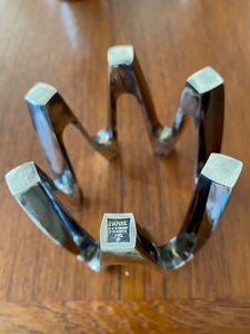 Bottom of MCM vintage silver plated Dansk JHQ candle holder. Looks beautiful with or without candles. Designed by Jens Harald Quistgaard for Dansk. Marked Dansk JHQ France- Cook Street Vintage