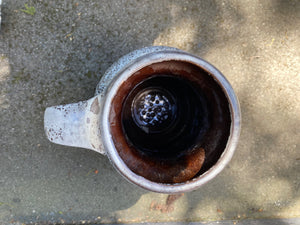 interior glaze of Fabulous West Germany&nbsp; ceramic jug circa 1960s. Textured "fat lava" or foam glaze in white and grey. The interior is glazed in a dark brown. In excellent condition. Stamped W German&nbsp; 0325-50 on base- Cook Street Vintage