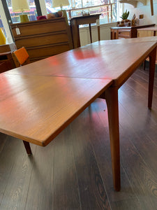 Side view of extended leaves of MCM Vejle Stole & Mobelfabrik teak dining table- Cook Street Vintage