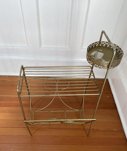 Detail of vintage steel magazine holder and ashtray holder showing some wear under ashtray- Cook Street Vintage